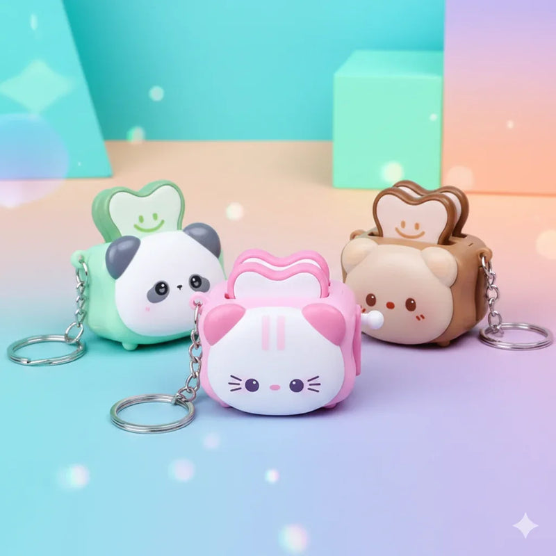 Llaveros kawaii de silicona con diseño animal: gato rosa, oso marrón y panda verde con rebanadas de pan