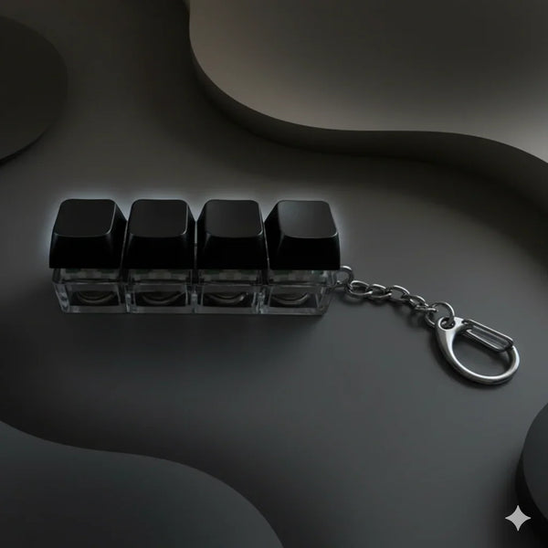 Llavero gamer con cuatro teclas negras de teclado mecánico y cadena metálica
