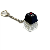 Mechanical keyboard switch keycap keychain with pixel heart and love design on white background