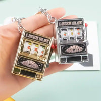 Llaveros originales en forma de máquina tragamonedas dorada y plateada, diseño creativo SHX.