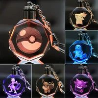 Llaveros SHX con luces LED, diseños Pokémon: Pokebola, Pikachu, Charmander, Mewtwo, Eevee y Gengar en cristal transparente