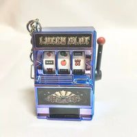 Llavero máquina tragamonedas metálica, original y creativo de Llaveros SHX, estilo casino.