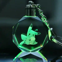 Llavero cristal con figura 3D de Pikachu iluminado en verde, diseño gamer y anime