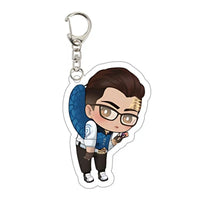 llavero gamer personaje anime con gafas, cabello castaño y chaleco azul, diseño original