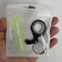 Llaveros SHX llavero spinner negro con anillo metálico en empaque transparente